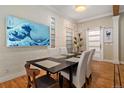 Dining room with ample seating, contemporary decor, and hardwood floors at 720 Lipan St, Denver, CO 80204
