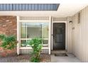 Inviting condo entrance featuring a decorative window and wreath-adorned front door at 6495 E Happy Canyon Rd # 114, Denver, CO 80237