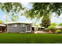 Expansive backyard with lush artificial grass, perfect for outdoor activities and relaxation at 7695 Quitman St, Westminster, CO 80030