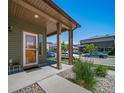 Inviting front porch featuring a stylish welcome sign, and ample natural light at 19120 E 54Th Pl, Denver, CO 80249