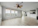 Bright living room featuring hard floors and multiple large windows offering lots of natural light at 13456 Via Varra # 401, Broomfield, CO 80020