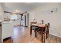 Kitchen with dining area and hardwood floors at 9303 W 66Th Pl, Arvada, CO 80004