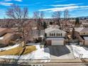 Aerial view of a two-story home showcases the property's layout, landscaping, and neighborhood at 7862 W Euclid Pl, Littleton, CO 80123