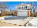 Charming two-story home with a well-maintained lawn, showcasing its classic architecture and welcoming curb appeal at 7862 W Euclid Pl, Littleton, CO 80123