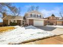 Charming two-story home with a well-maintained lawn, showcasing its classic architecture and welcoming curb appeal at 7862 W Euclid Pl, Littleton, CO 80123