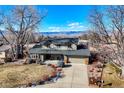 Two-story house with a large yard and mountain views at 7913 Grasmere Dr, Boulder, CO 80301