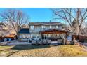 Covered patio with outdoor kitchen and dining area at 7913 Grasmere Dr, Boulder, CO 80301