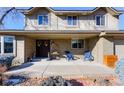 Brick front porch with seating, creating a welcoming entrance at 7913 Grasmere Dr, Boulder, CO 80301