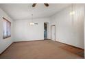 Spacious dining room with hardwood floors and neutral walls at 1434 Hickory Dr, Erie, CO 80516