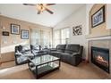 Living room with fireplace, recessed lighting, and comfortable seating at 1434 Hickory Dr, Erie, CO 80516
