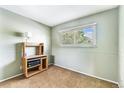 A simple bedroom provides plenty of sunlight and has neutral-toned walls at 628 S Carr St, Lakewood, CO 80226