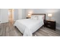 Comfortable bedroom with hardwood floors, ensuite bathroom, and ample natural light at 13952 E Marina Dr # 310, Aurora, CO 80014