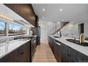 Modern kitchen with stainless steel appliances and an island at 5098 E Donald, Denver, CO 80222