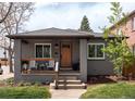 Charming single-story home with a covered porch and well-maintained landscaping at 489 S Gaylord St, Denver, CO 80209