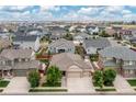Real estate aerial view shows a neighborhood featuring a well-maintained home at 646 Gamble Oak St, Brighton, CO 80601