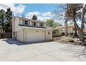 Lovely light brick home featuring a spacious two-car garage and well-maintained yard at 14582 E Harvard Ave, Aurora, CO 80014