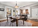 Dining room adjacent to kitchen features wood table, chairs, and ample natural light at 1419 N Adams St, Denver, CO 80206