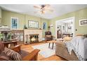 Cozy living room with a tiled fireplace, hardwood floors, and comfortable seating at 1419 N Adams St, Denver, CO 80206