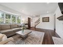 Stylish living room boasts hardwood floors, a cozy fireplace, and a large bay window at 8981 E Amherst Dr # E, Denver, CO 80231