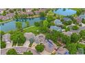 Breathtaking aerial view of the property, showcasing its proximity to lush landscaping and a serene lake at 3237 W 113Th Ave, Westminster, CO 80031