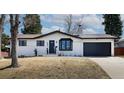 Charming ranch-style home featuring a manicured lawn and an attached two car garage at 3400 S Ivy Way, Denver, CO 80222