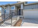 Charming new home showcases stone accents, a covered porch, and an attached garage, modern design at 1871 Grayside Cir, Castle Rock, CO 80109