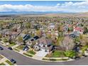 Expansive aerial view of a residential neighborhood with mountain views, showcasing the home's prime location at 2359 Dogwood Dr, Erie, CO 80516