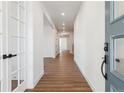 Bright entryway with wood-look floors and modern white trim at 8601 Yellowcress St, Littleton, CO 80125