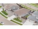 Aerial view of a well-kept neighborhood featuring a home with a landscaped yard and inviting backyard patio at 18071 Marsh Wren Ave, Parker, CO 80134
