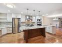 Spacious kitchen featuring stainless steel appliances, granite countertops, and a central island at 2609 S Quebec S St # 20, Denver, CO 80231