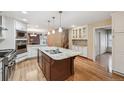 Well-lit kitchen with a large center island, stainless appliances and granite countertops at 2609 S Quebec S St # 20, Denver, CO 80231
