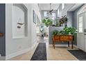 Grand entryway with soaring ceilings, tile flooring, and stylish decor leading into the open-concept living space at 11307 Navajo Cir # A, Westminster, CO 80234