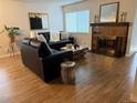 Cozy living room with fireplace, modern decor, and ample natural light at 11753 Pennsylvania St, Northglenn, CO 80233