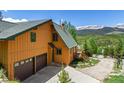 Attractive exterior featuring a two-story home with a garage and scenic mountain backdrop at 422 Fairview Blvd, Breckenridge, CO 80424