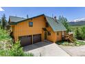 Inviting two-story home with a two-car garage and beautiful mountain views in the background at 422 Fairview Blvd, Breckenridge, CO 80424