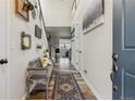 Inviting entryway with wood floors, a stylish bench, and decorative wall accents at 6616 Amur Ln, Castle Rock, CO 80108
