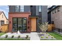 A modern home with unique architectural details and inviting front porch at 716 S Race St, Denver, CO 80209