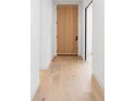Clean hallway features light hardwood floors and contemporary design at 716 S Race St, Denver, CO 80209