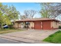Lovely single-story brick home with a two-car garage and mature landscaping at 258 S 14Th Ave, Brighton, CO 80601