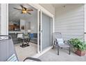 Balcony with seating and a potted plant, provides an exterior view from a living area at 4451 S Ammons St # 4-203, Littleton, CO 80123
