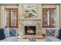 Cozy living room with a marble fireplace, bright windows, and comfortable seating at 350 Albion St, Denver, CO 80220
