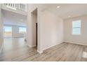 Bright living room with hard surface floors and modern recessed lighting at 14139 Bunny Hop Ln, Parker, CO 80134