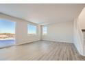 Spacious living area with large windows, hard surface floors, and modern design at 14139 Bunny Hop Ln, Parker, CO 80134