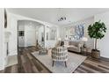 Open living space with fireplace and adjacent entryway at 9980 W Jewell Ave # B, Lakewood, CO 80232