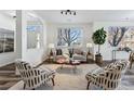 Living room with hardwood floors, neutral decor, and large windows at 9980 W Jewell Ave # B, Lakewood, CO 80232