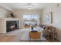 Living room features a fireplace and sliding glass doors to a balcony at 15700 E Jamison Dr # 7-205, Englewood, CO 80112