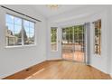 Bright dining area boasts hardwood floors, neutral walls and natural light from adjacent sliding doors at 4883 W 68Th Ave # 3, Westminster, CO 80030
