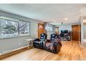 Inviting living room boasting hardwood floors, a large window, and comfortable seating at 12434 E Alaska Ave, Aurora, CO 80012