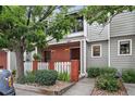 Charming townhouse with brick facade, well-maintained landscaping, and mature trees in a peaceful neighborhood at 7474 E Arkansas Ave # 18-10, Denver, CO 80231