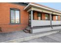 Charming front porch with classic brick exterior, providing a welcoming entrance at 561 Cherokee St, Denver, CO 80204